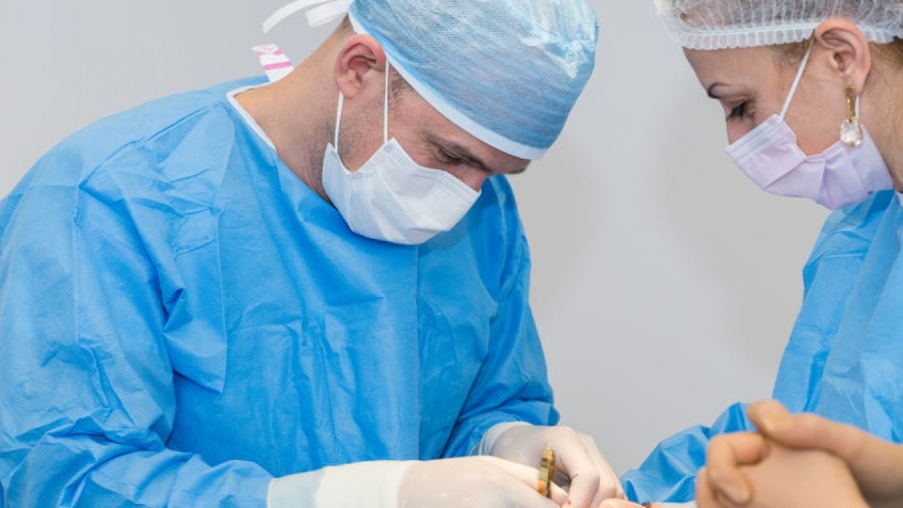 Dentists during surgery for implant placement